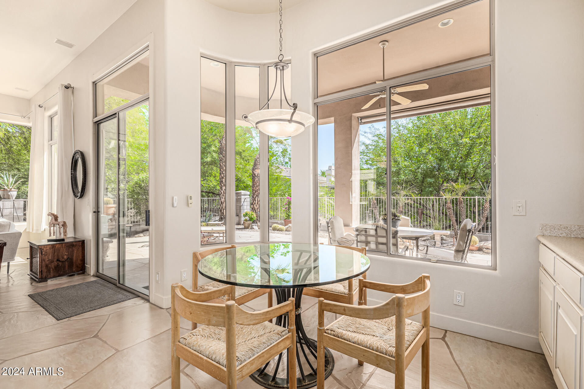 6437 North 28th Street Phoenix, AZ 85016 - Photo 18 of 53 a dining room with furniture a chandelier and wooden floor