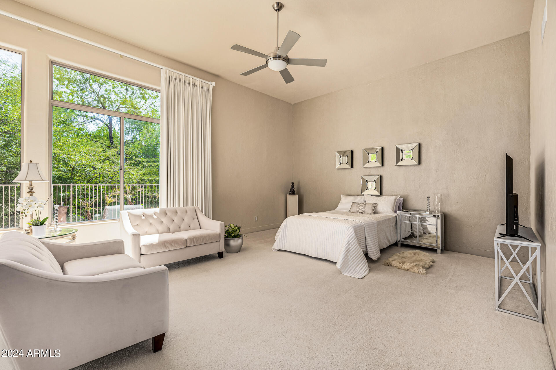 6437 North 28th Street Phoenix, AZ 85016 - Photo 22 of 53 a bedroom with a bed couch and a large window