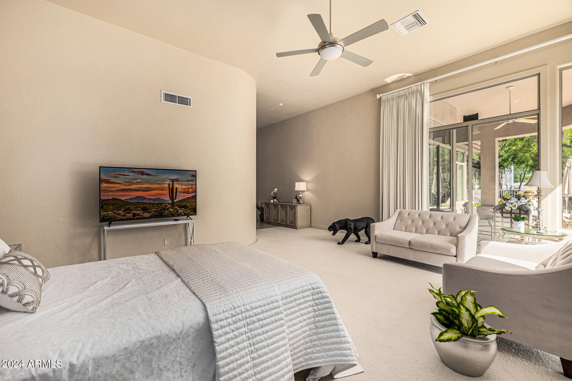 6437 North 28th Street Phoenix, AZ 85016 - Photo 23 of 53 a bedroom with a bed a large window and couch