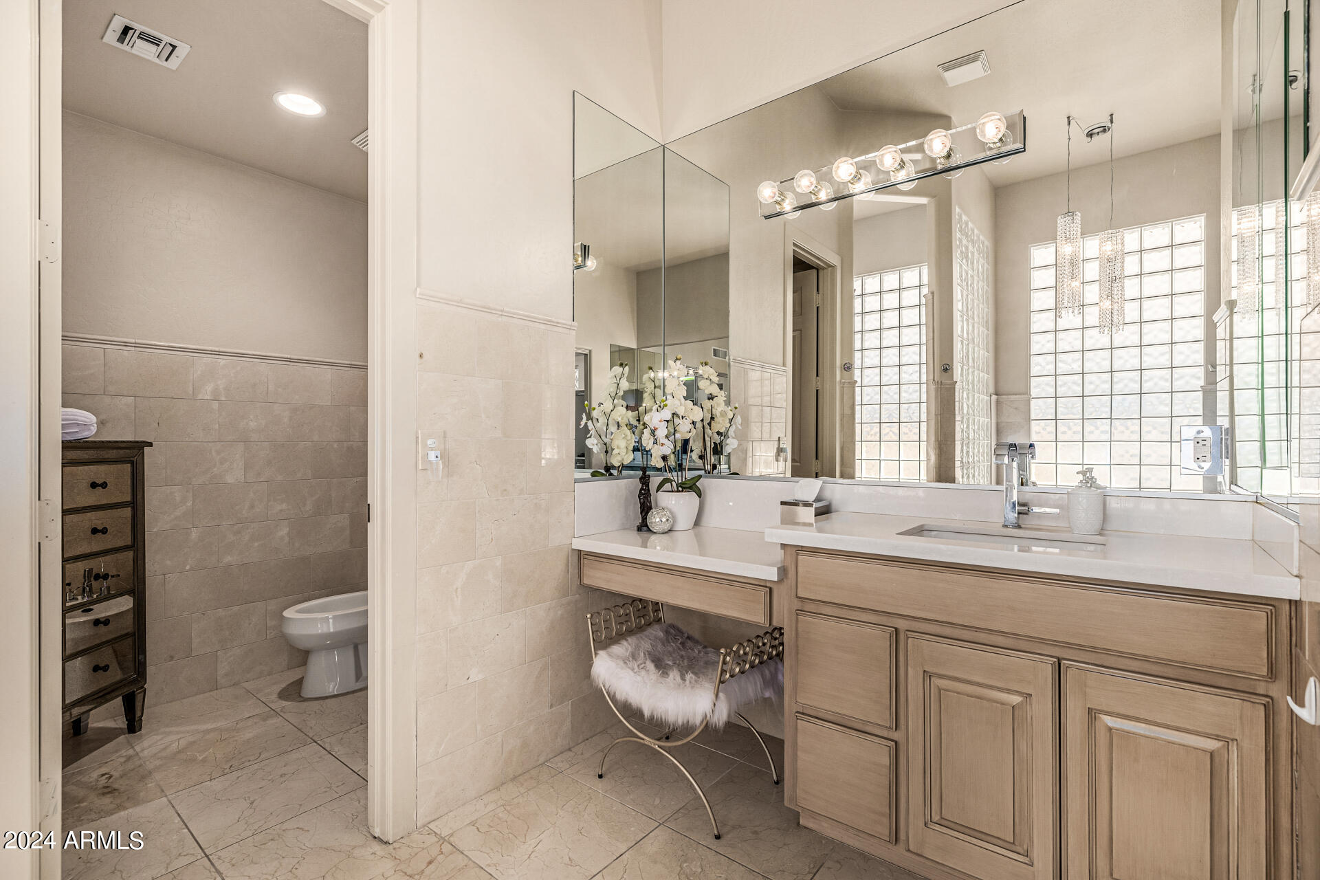 6437 North 28th Street Phoenix, AZ 85016 - Photo 29 of 53 a bathroom with a granite countertop sink a toilet a mirror and shower