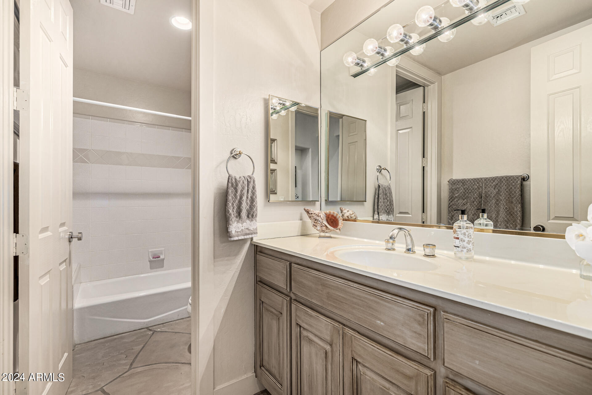 6437 North 28th Street Phoenix, AZ 85016 - Photo 35 of 53 a bathroom with a double vanity sink mirror and bathtub