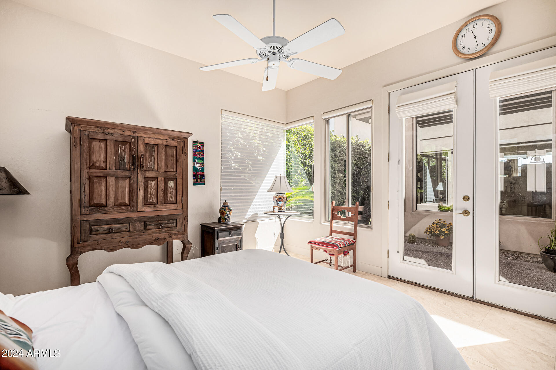 6437 North 28th Street Phoenix, AZ 85016 - Photo 40 of 53 a bedroom with a bed and a chandelier
