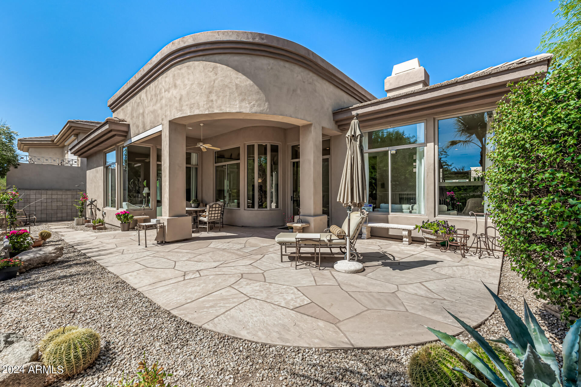 6437 North 28th Street Phoenix, AZ 85016 - Photo 45 of 53 a view of a house with backyard sitting area and porch