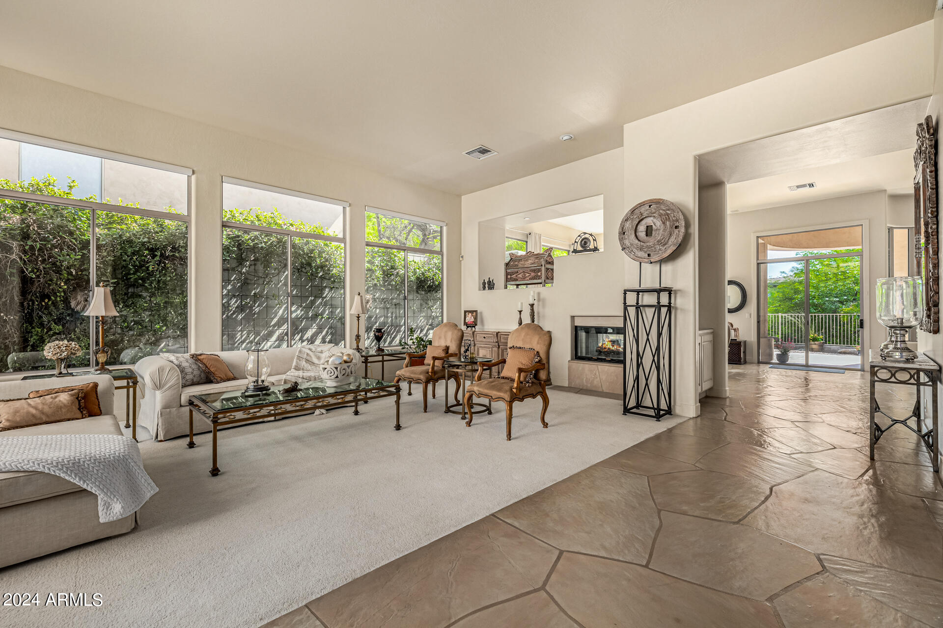 6437 North 28th Street Phoenix, AZ 85016 - Photo 6 of 53 a living room with furniture a fireplace and a large window