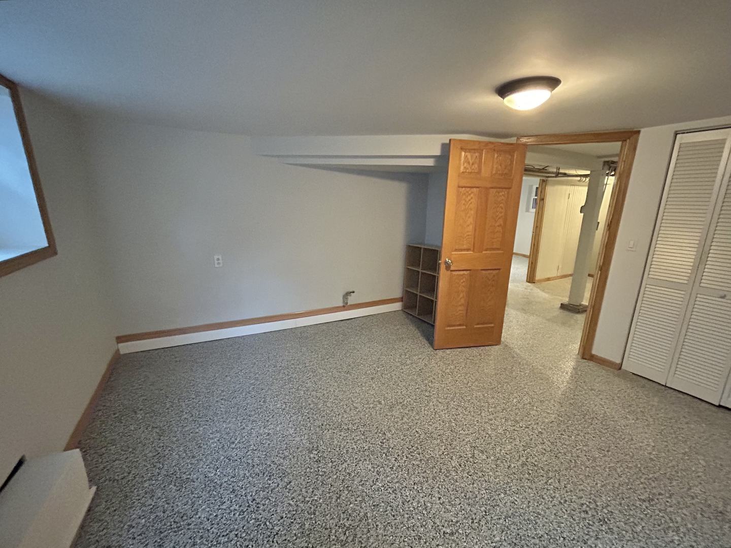 3056 West Lyndale Street, Unit G Chicago, IL 60647 - Photo 7 of 11 an empty room with entrance and windows