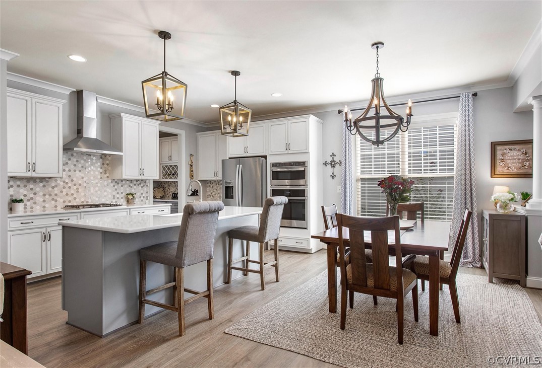 12233 Bremner Ridge Circle Manakin-Sabot, VA 23103 - Photo 12 of 49 a view of a dining room with furniture window and wooden floor