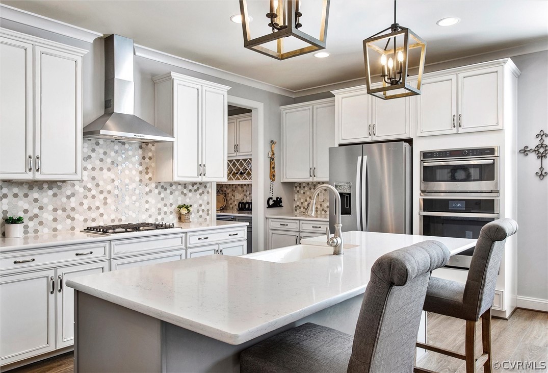 12233 Bremner Ridge Circle Manakin-Sabot, VA 23103 - Photo 13 of 49 a kitchen with stainless steel appliances kitchen island granite countertop a dining table chairs and cabinets