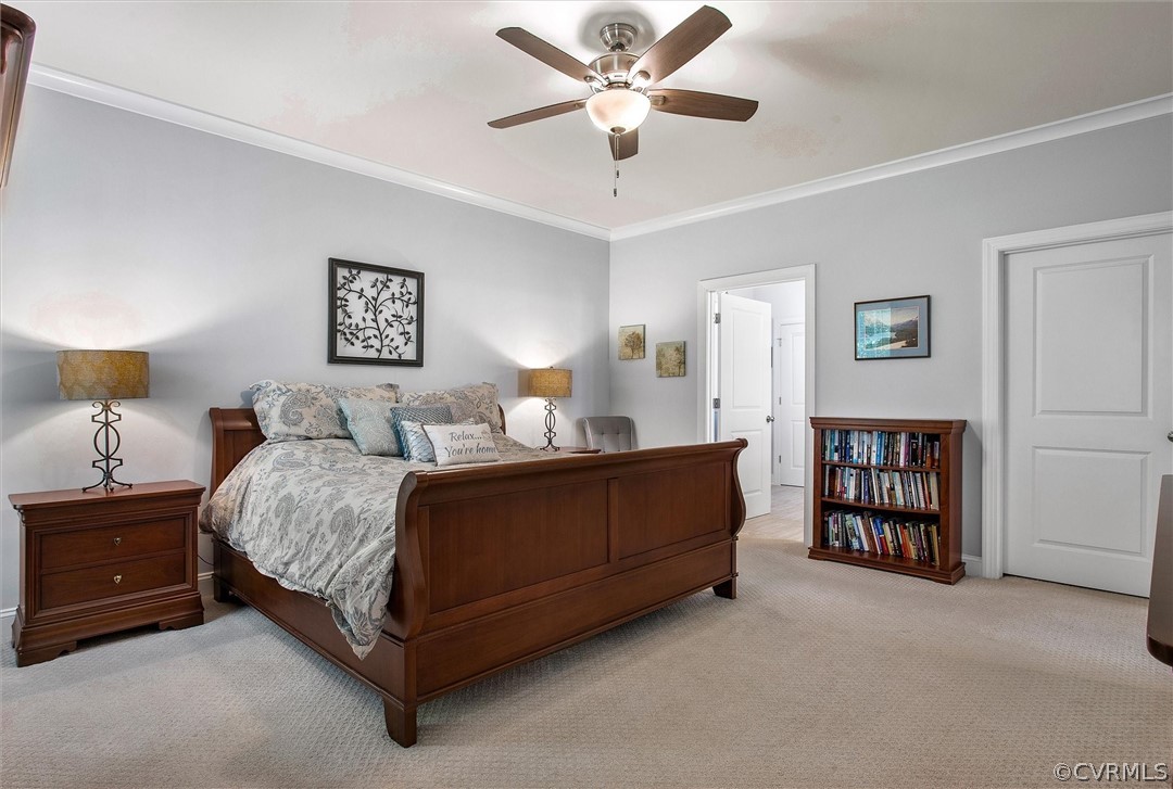 12233 Bremner Ridge Circle Manakin-Sabot, VA 23103 - Photo 27 of 49 a bedroom with a bed and ceiling fan