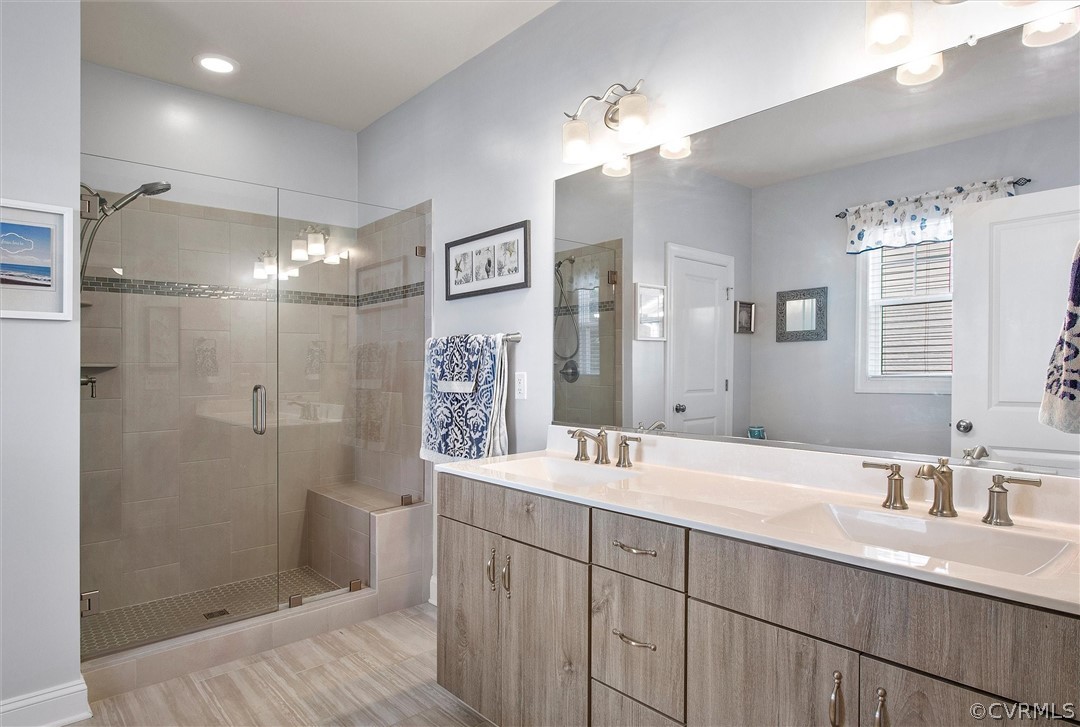 12233 Bremner Ridge Circle Manakin-Sabot, VA 23103 - Photo 29 of 49 a bathroom with a double vanity sink mirror and shower
