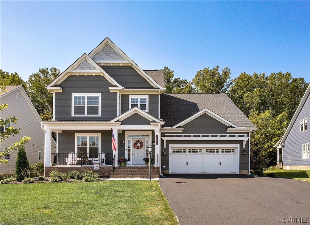 12233 Bremner Ridge Circle Manakin-Sabot, VA 23103 - Photo 3 of 49 a front view of a house with a yard