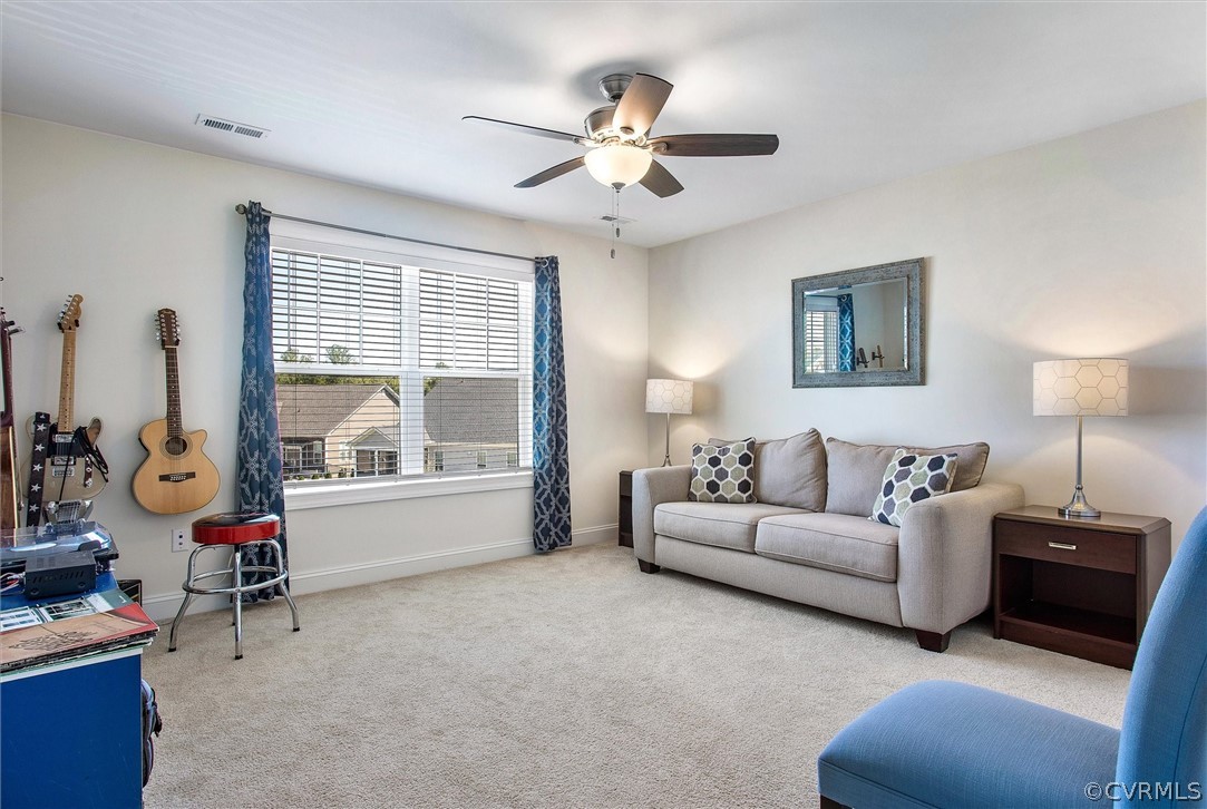 12233 Bremner Ridge Circle Manakin-Sabot, VA 23103 - Photo 33 of 49 a living room with furniture and a large window