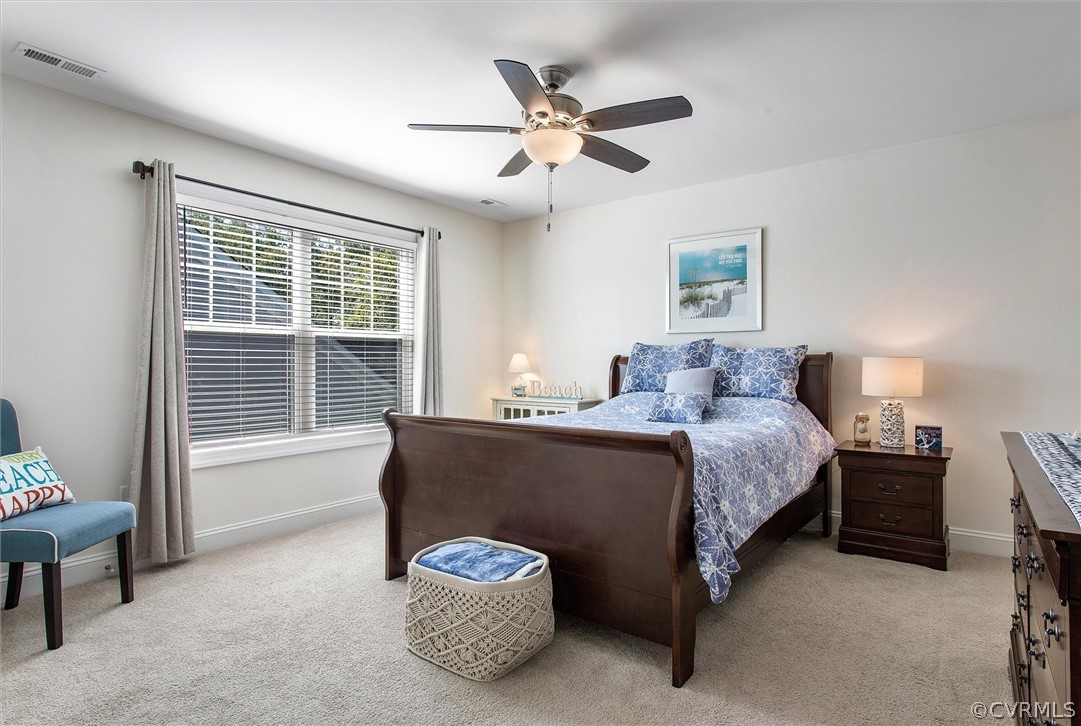 12233 Bremner Ridge Circle Manakin-Sabot, VA 23103 - Photo 35 of 49 a spacious bedroom with a bed and a window