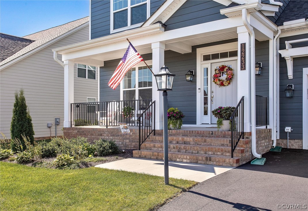 12233 Bremner Ridge Circle Manakin-Sabot, VA 23103 - Photo 4 of 49 a front view of a house with a yard
