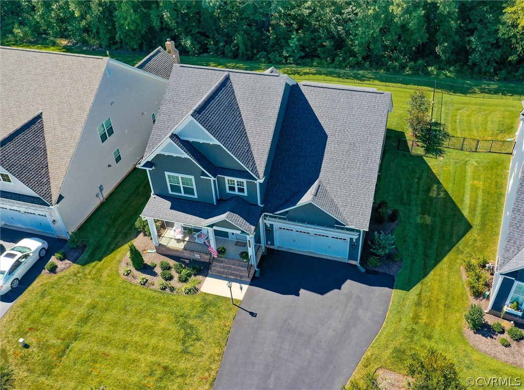 12233 Bremner Ridge Circle Manakin-Sabot, VA 23103 - Photo 44 of 49 an aerial view of a house with swimming pool and large trees