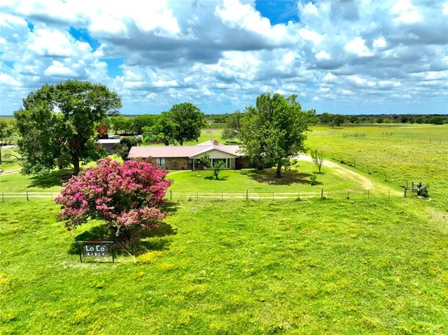 a view of a lake with a big yard