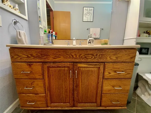 a bathroom with a sink and a mirror