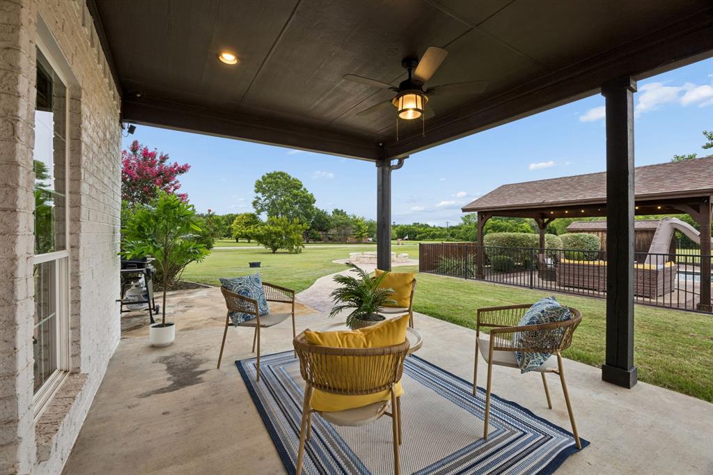1700 Rock Ridge Road Lucas, TX 75002 - Photo 29 of 37 The moment you step outside, everything feels so calm and peaceful. All of the porches are shaded in the evening as the front of the home faces west.