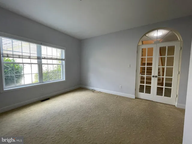 an empty room with windows