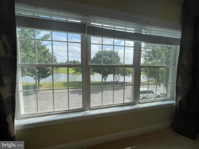 a view of a room with a large window