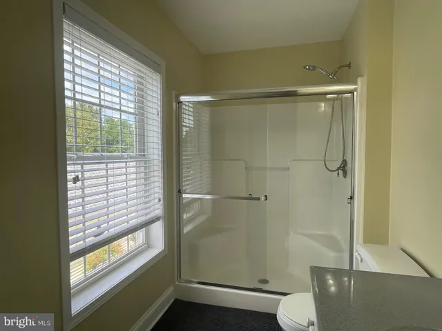 a utility room with cabinets washer and dryer