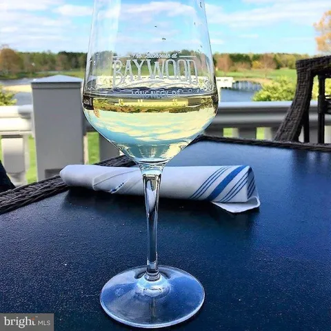 a front view of a house with a yard table and seating