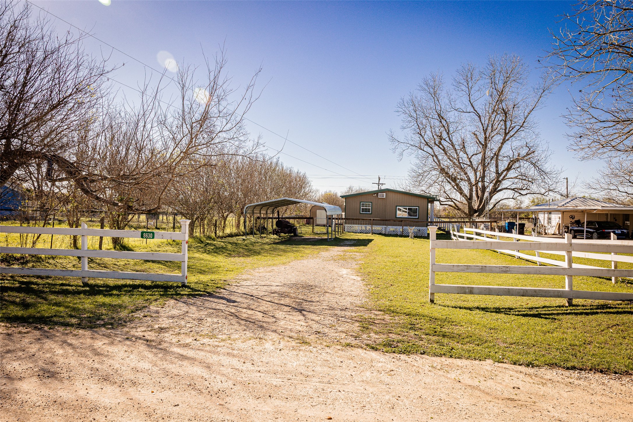 8608 Captain Scott Road Brenham, TX 77833 - Photo 26 of 28 a view of a yard with cars parked on road