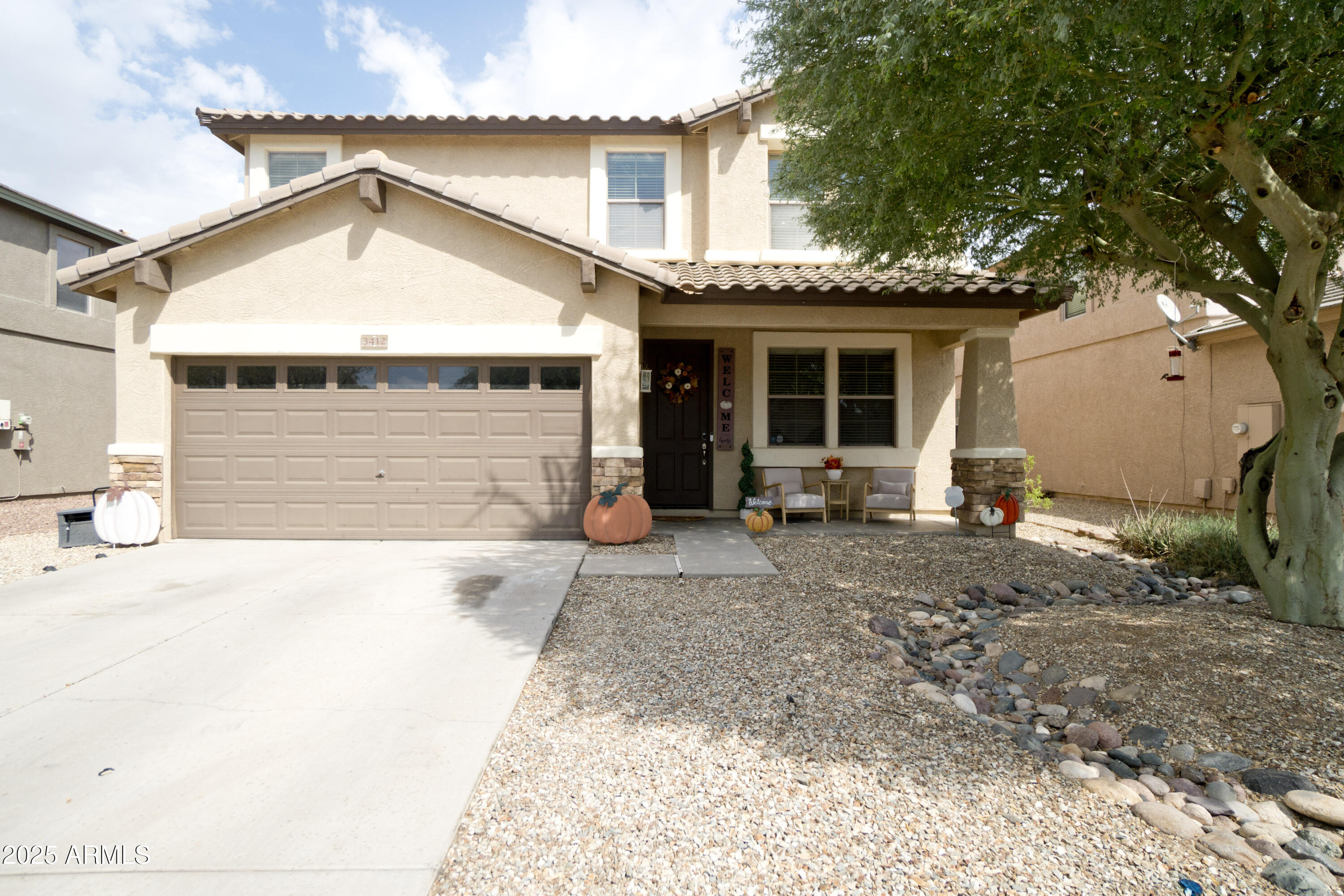 3412 West Apollo Road Phoenix, AZ 85041 - Photo 1 of 39 a view of a house with a yard and large tree