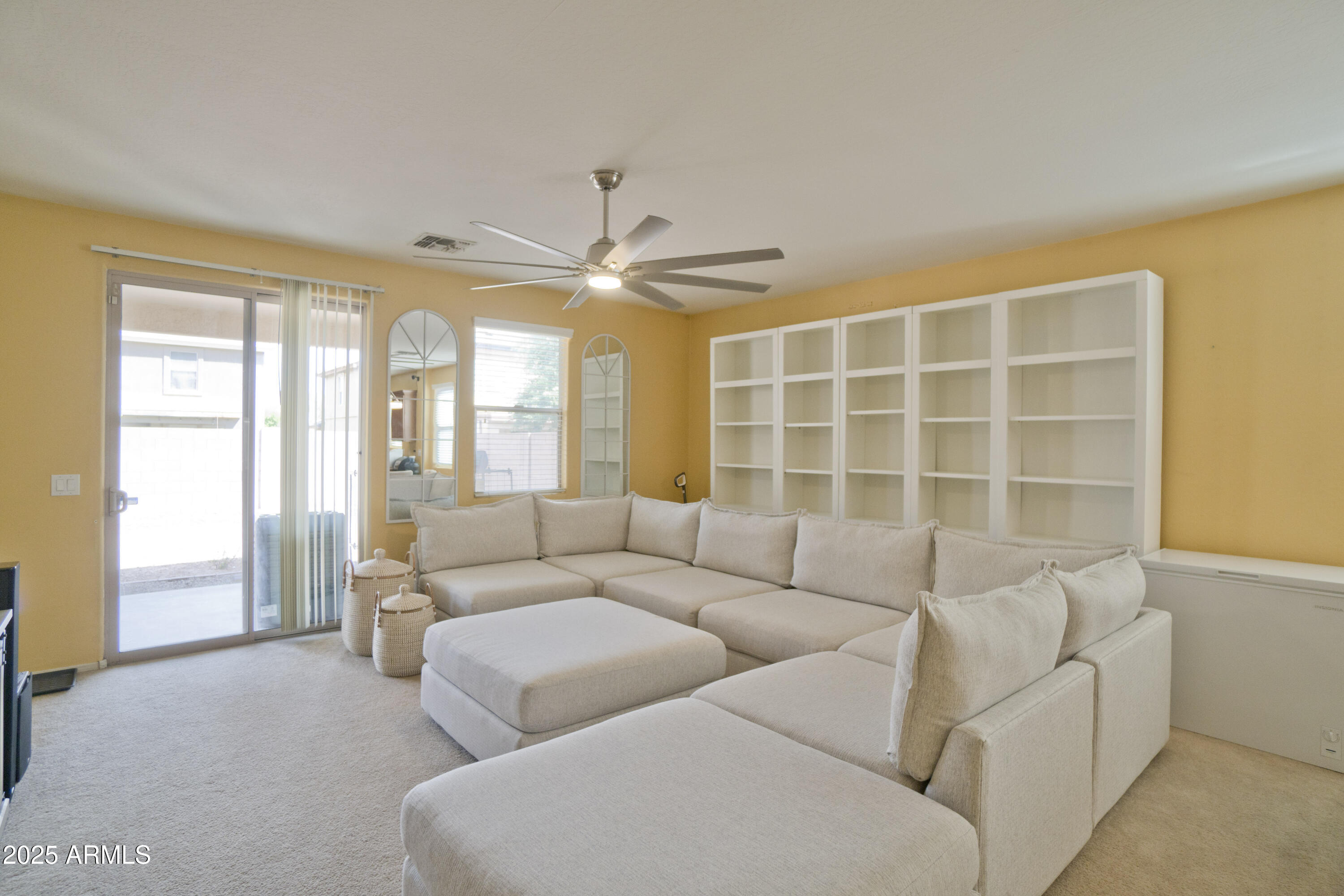 3412 West Apollo Road Phoenix, AZ 85041 - Photo 15 of 39 a living room with furniture and a large window