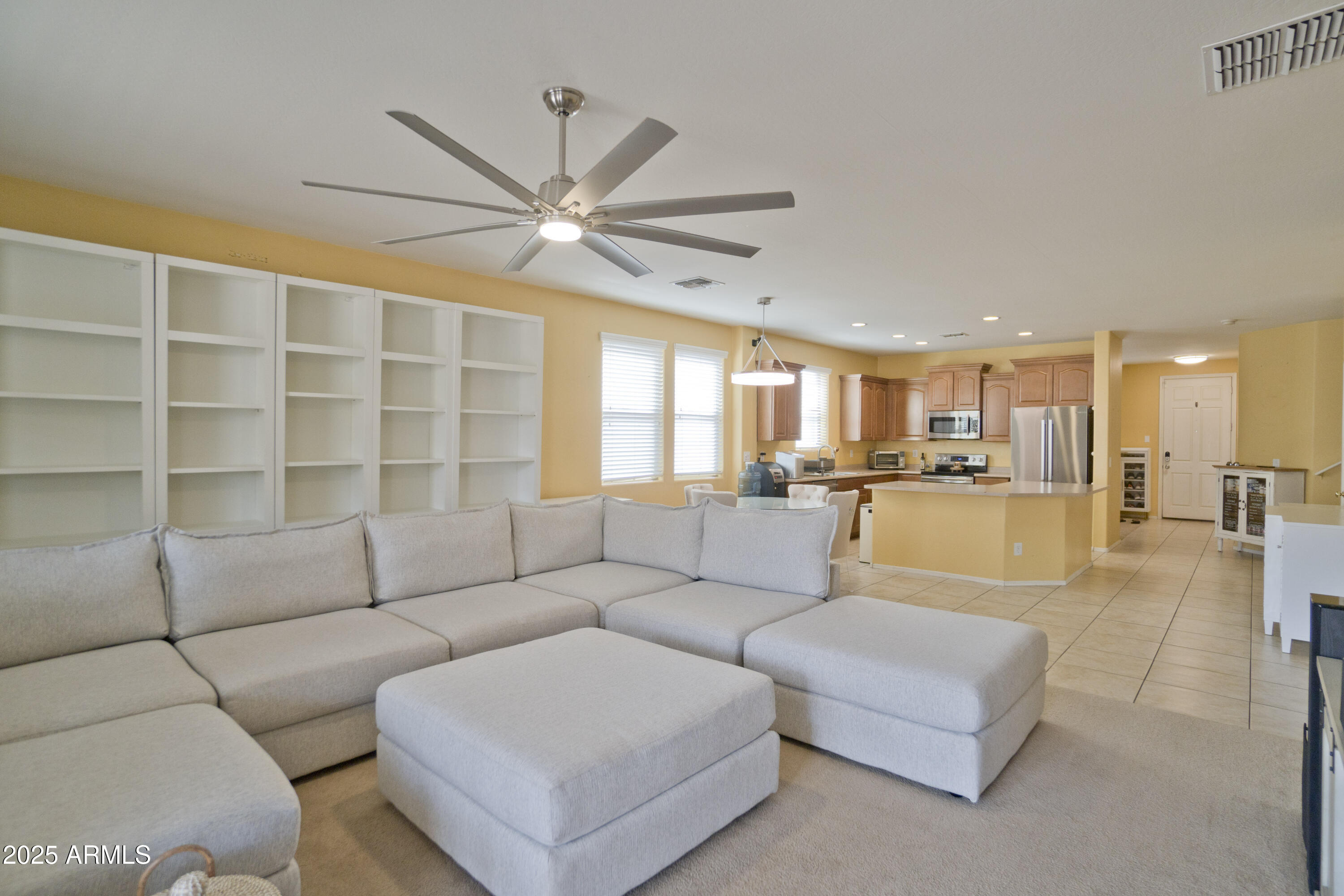 3412 West Apollo Road Phoenix, AZ 85041 - Photo 16 of 39 a living room with furniture and a view of kitchen