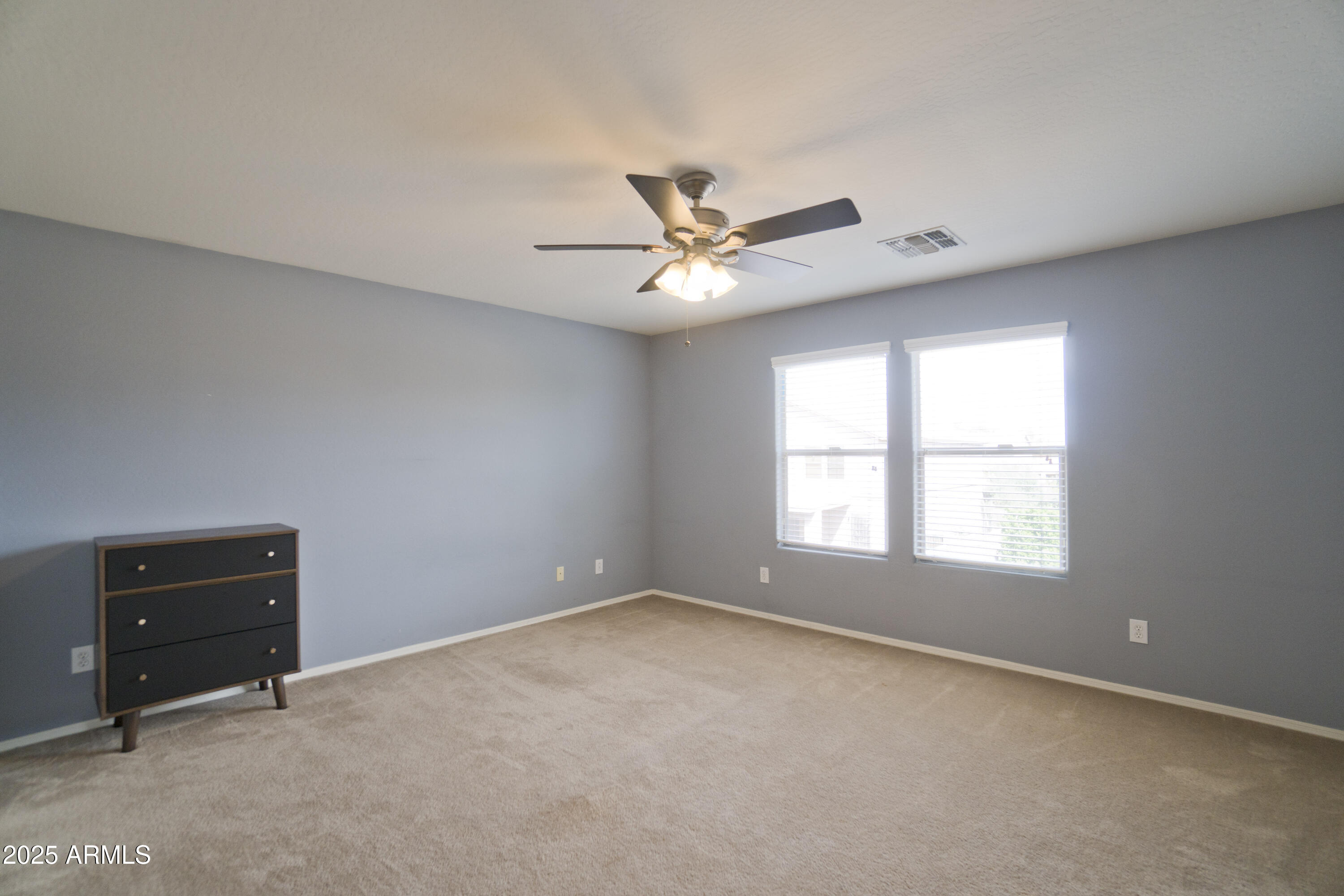 3412 West Apollo Road Phoenix, AZ 85041 - Photo 34 of 39 a view of a livingroom with a ceiling fan and a window