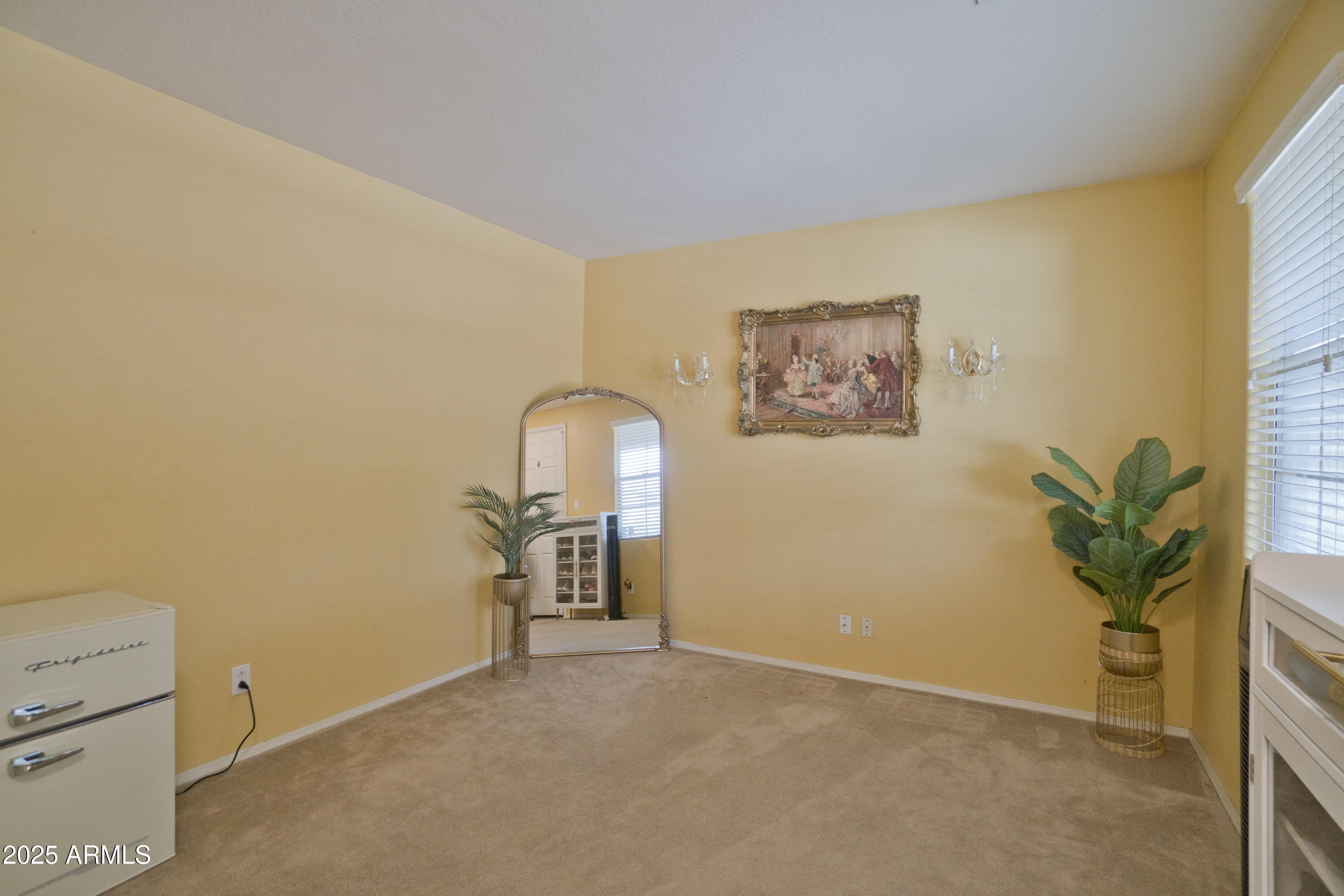 3412 West Apollo Road Phoenix, AZ 85041 - Photo 6 of 39 a view of a room with furniture and a potted plant
