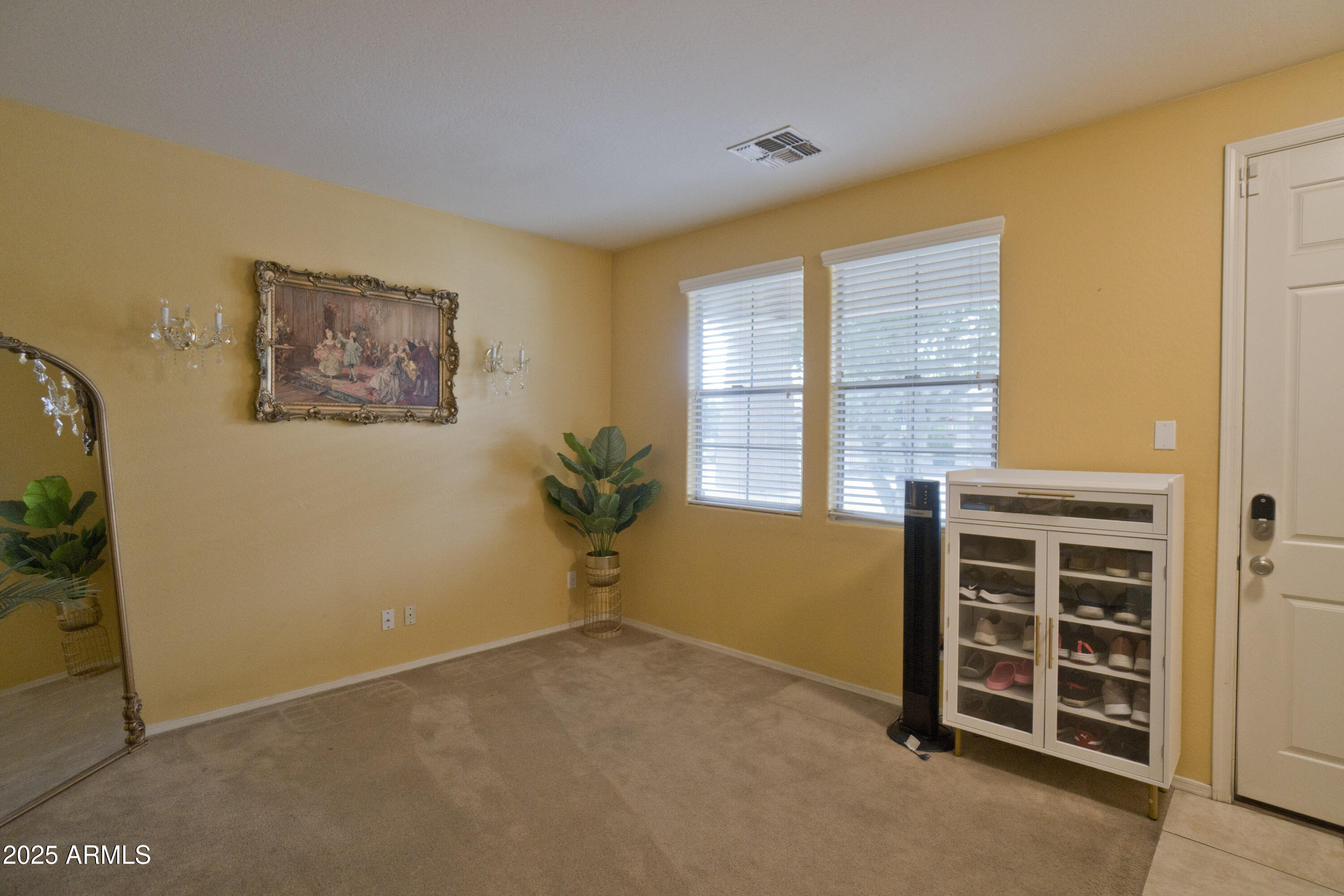 3412 West Apollo Road Phoenix, AZ 85041 - Photo 7 of 39 a view of an empty room with a window