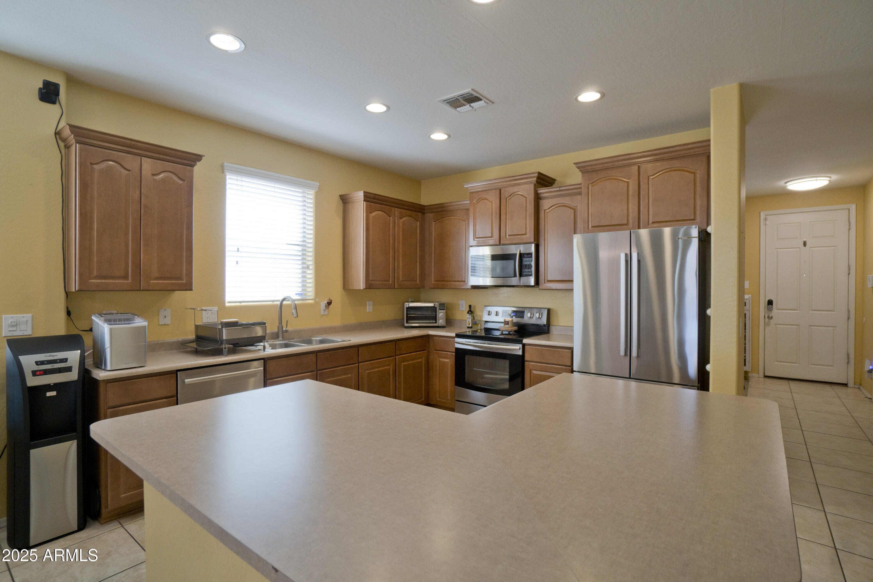 3412 West Apollo Road Phoenix, AZ 85041 - Photo 8 of 39 a kitchen with granite countertop a refrigerator stove top oven and sink