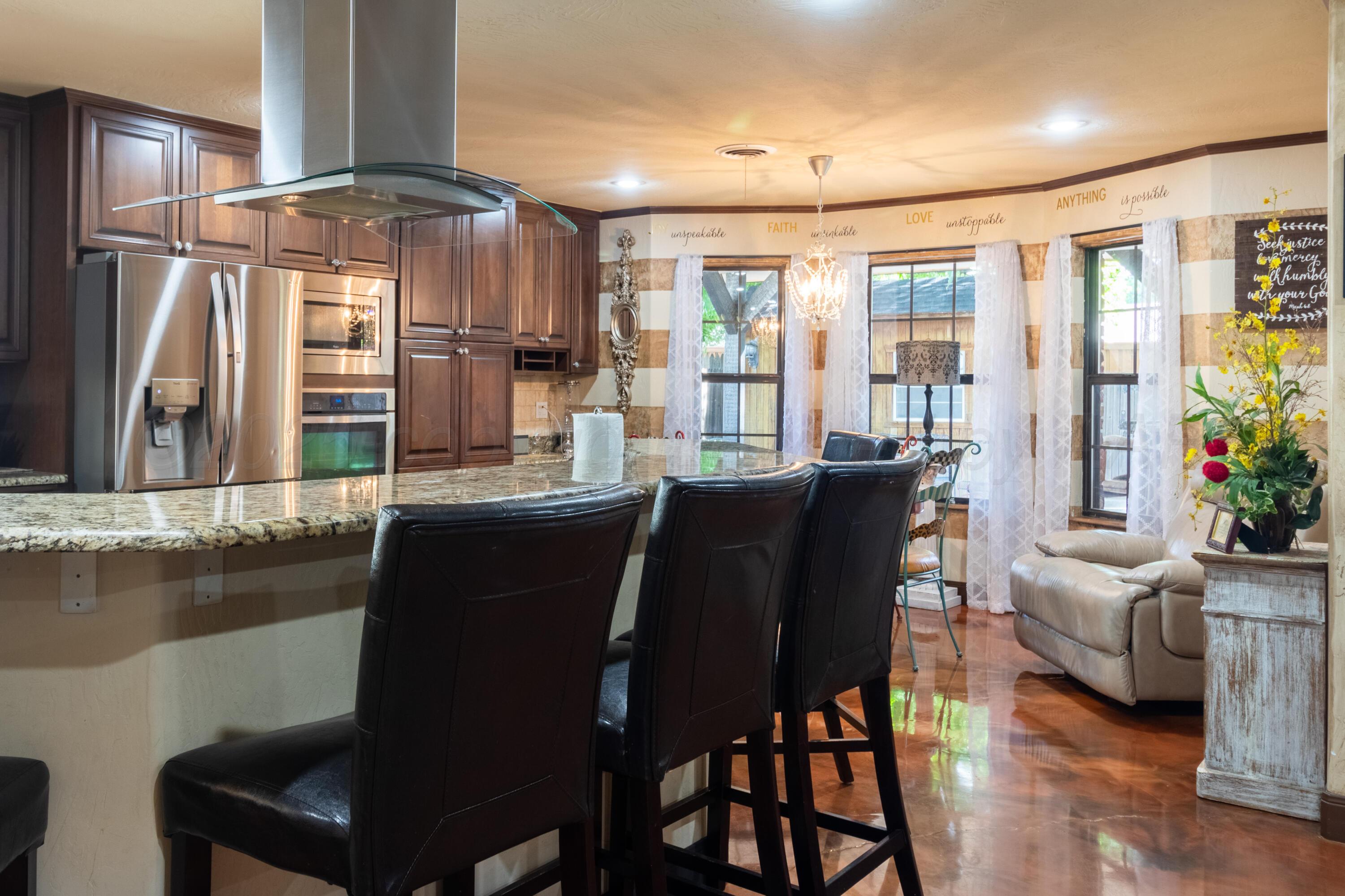 7104 Dreyfuss Road Amarillo, TX 79106 - Photo 11 of 43 a view of a dining room with furniture window and wooden floor