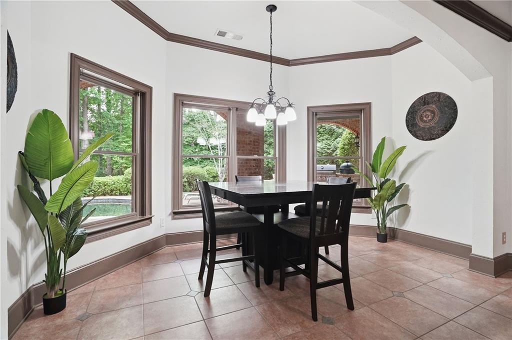 8340 Colonial Place Duluth, GA 30097 - Photo 45 of 74 a dining room with furniture and window