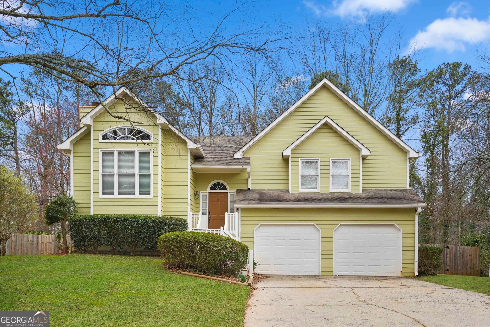 3435 Alexander Place Southwest Smyrna, GA 30082 - Photo 1 of 14 a front view of a house with a yard