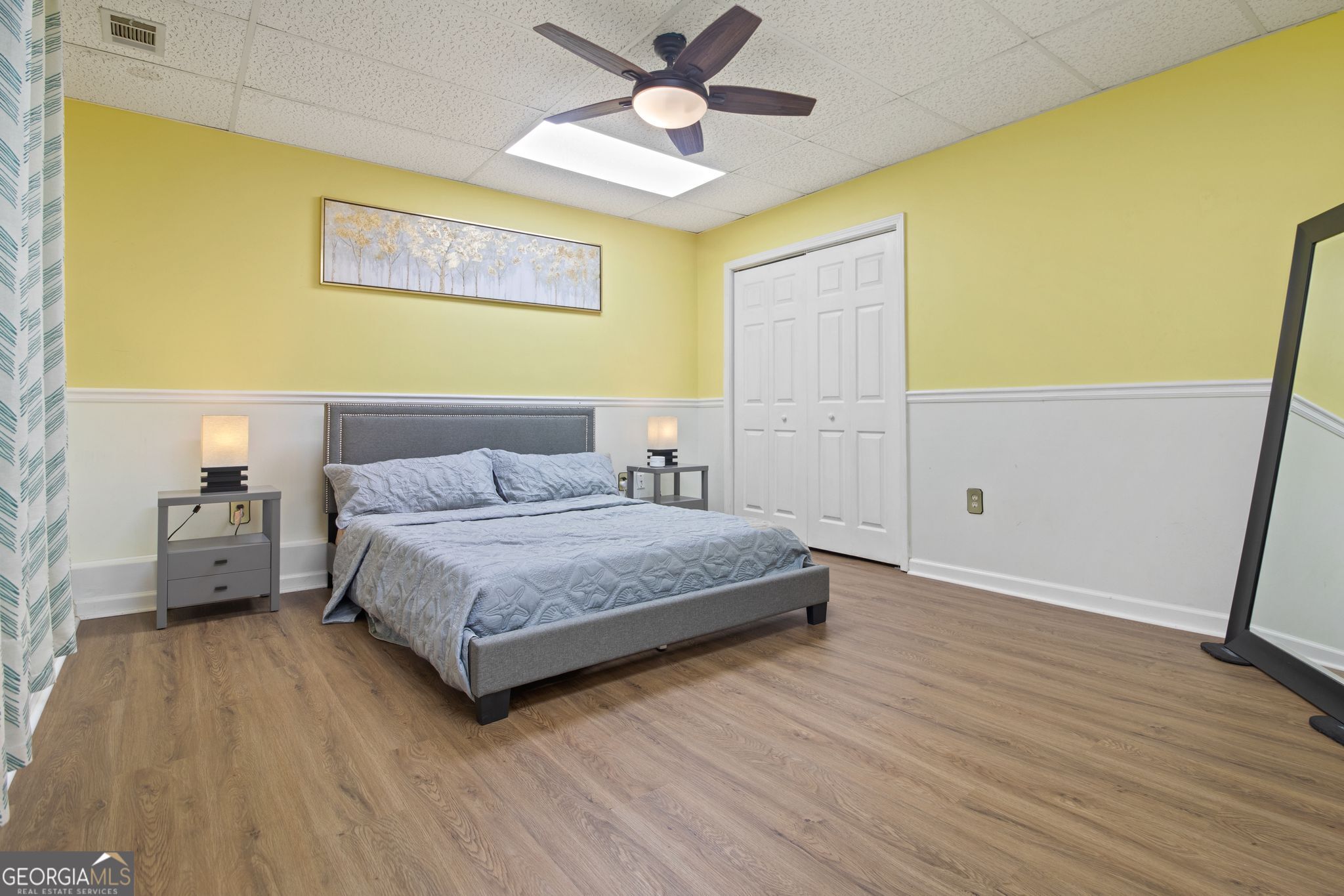3435 Alexander Place Southwest Smyrna, GA 30082 - Photo 10 of 14 a spacious bedroom with a bed and a ceiling fan