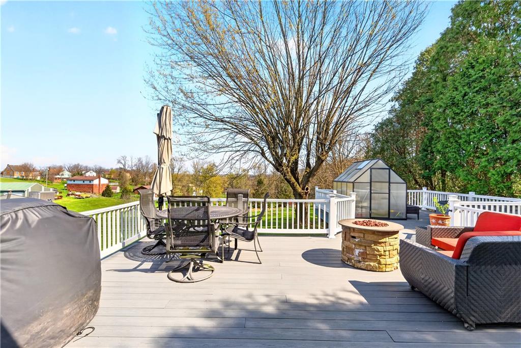 8 Snyder Avenue Monongahela, PA 15063 - Photo 42 of 48 a view of a patio with couches chairs and wooden floor