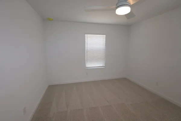 a white toilet sitting next to a bath tub