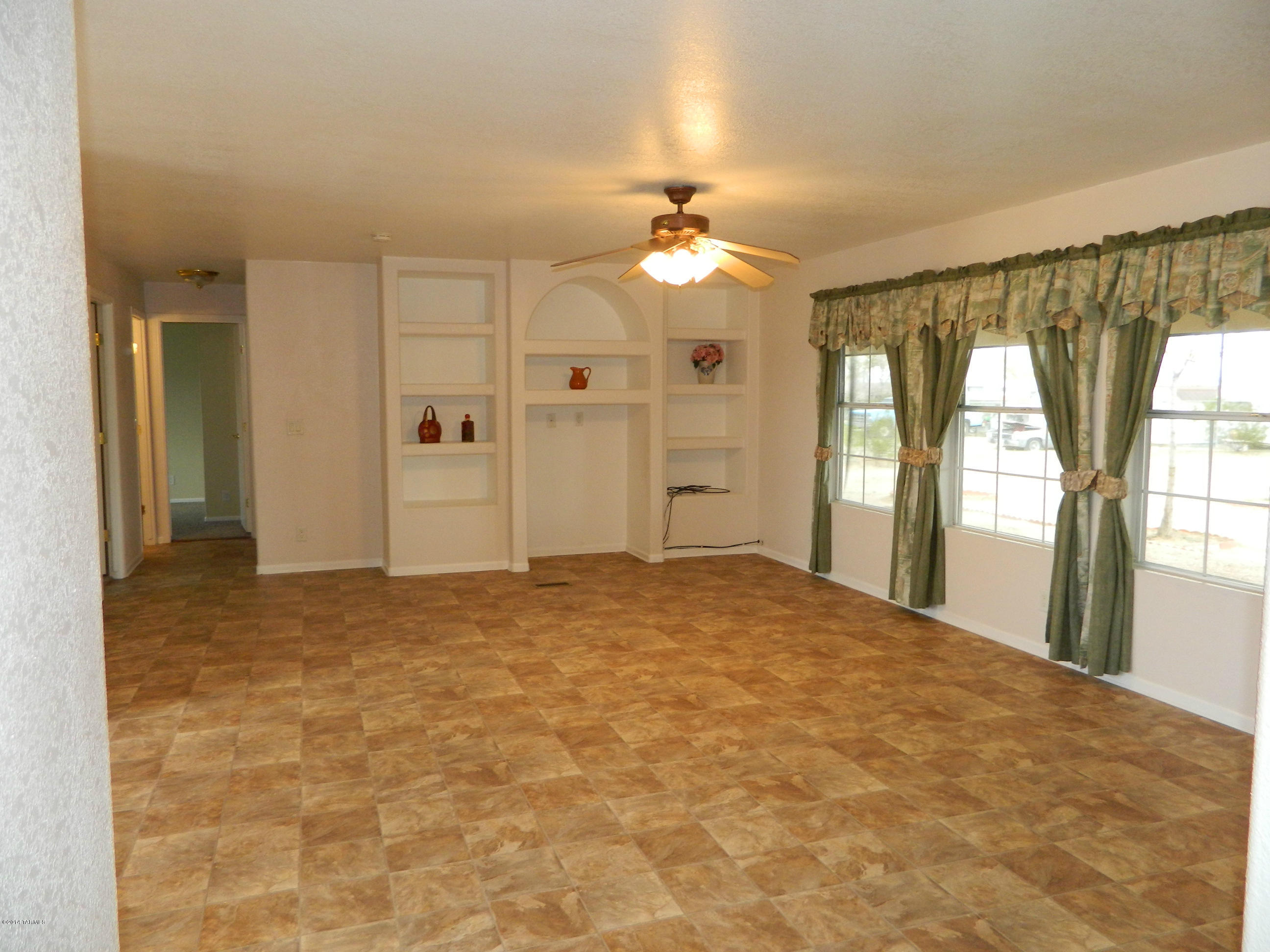 5204 North Puma Road Marana, AZ 85653 - Photo 6 of 36 a view of an empty room with a window