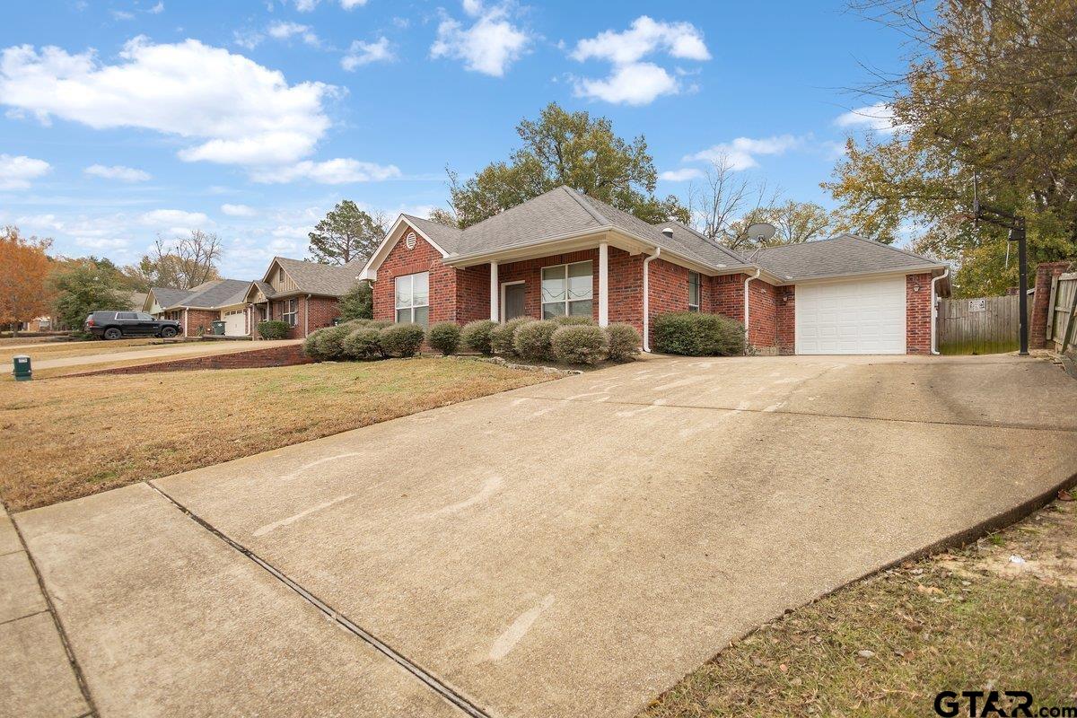 2801 Valley View Street Tyler, TX 75701 - Photo 3 of 14 a front view of a house with a yard and trees