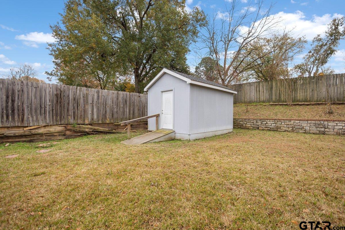 2801 Valley View Street Tyler, TX 75701 - Photo 6 of 14 a view of backyard with wooden fence and large trees