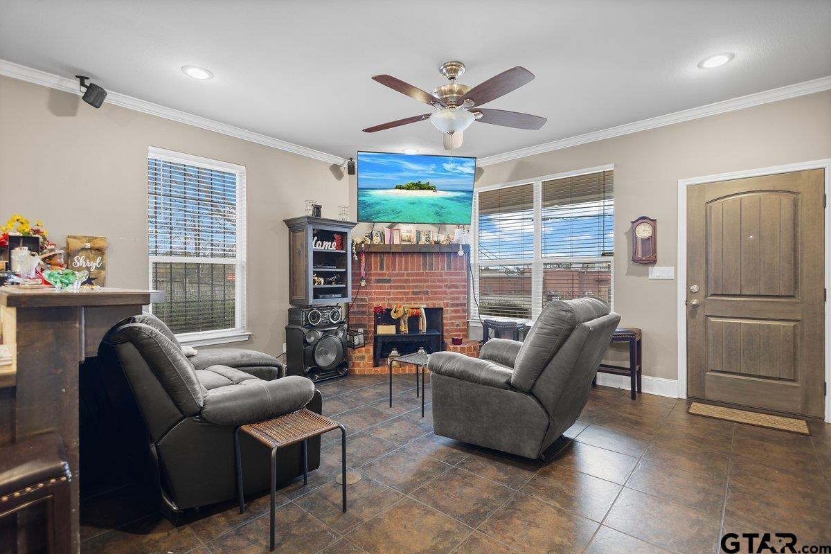 2801 Valley View Street Tyler, TX 75701 - Photo 7 of 14 a living room with furniture ceiling fan and a window