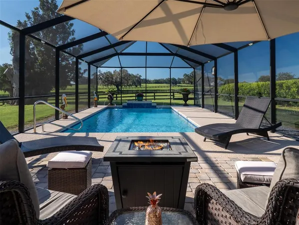 a view of a swimming pool with a patio