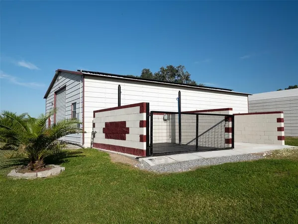 an aerial view of a house with a swimming pool