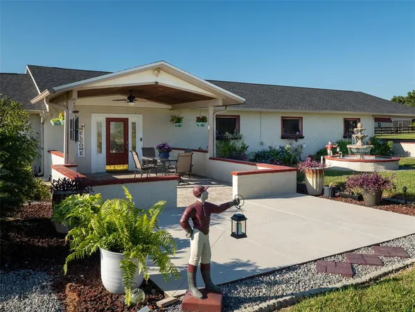a front view of a house with sitting area