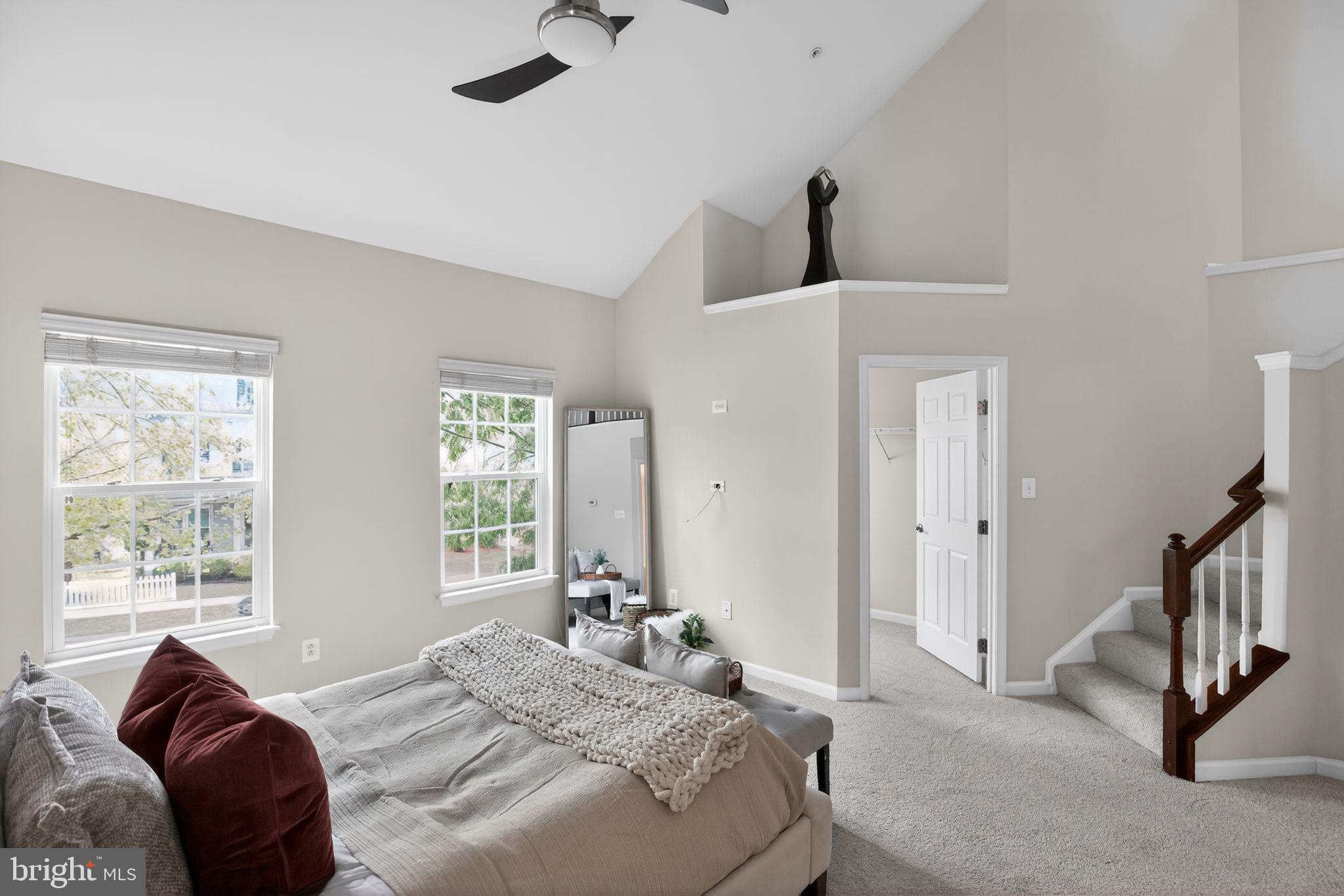 2624 St Marys View Road Accokeek, MD 20607 - Photo 15 of 31 a bedroom with a bed a couch and a large window