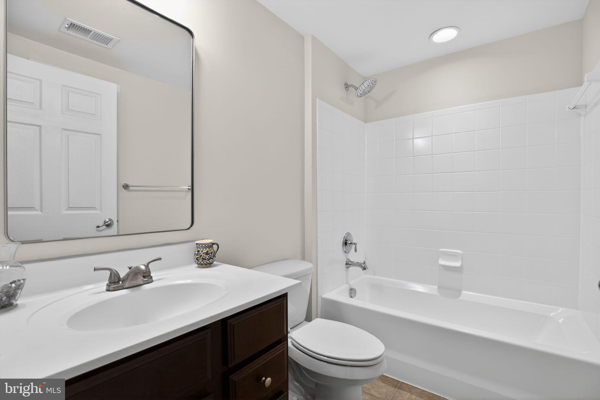 2624 St Marys View Road Accokeek, MD 20607 - Photo 24 of 31 a bathroom with a sink toilet vanity and tub