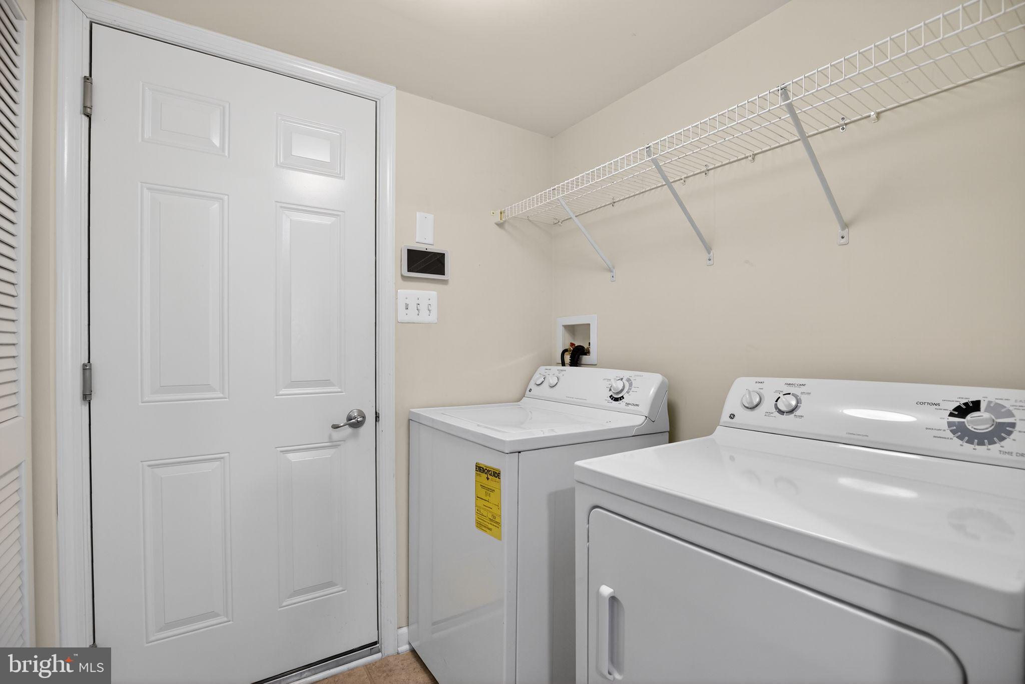 2624 St Marys View Road Accokeek, MD 20607 - Photo 28 of 31 a view of storage and utility room with dryer and washer