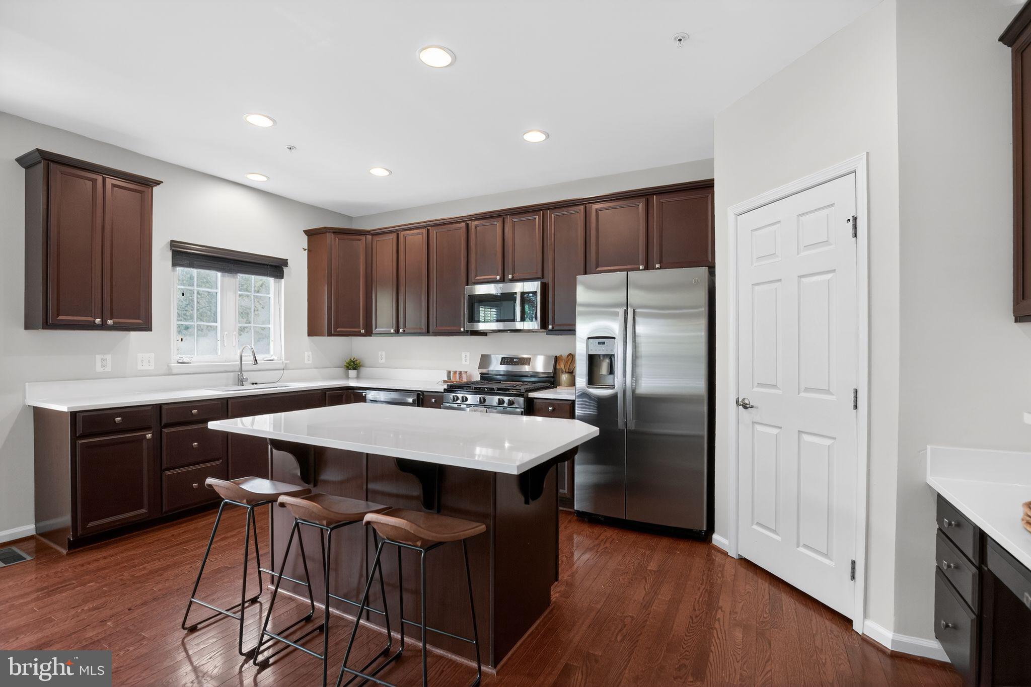 2624 St Marys View Road Accokeek, MD 20607 - Photo 7 of 31 a kitchen with refrigerator cabinets and wooden floor